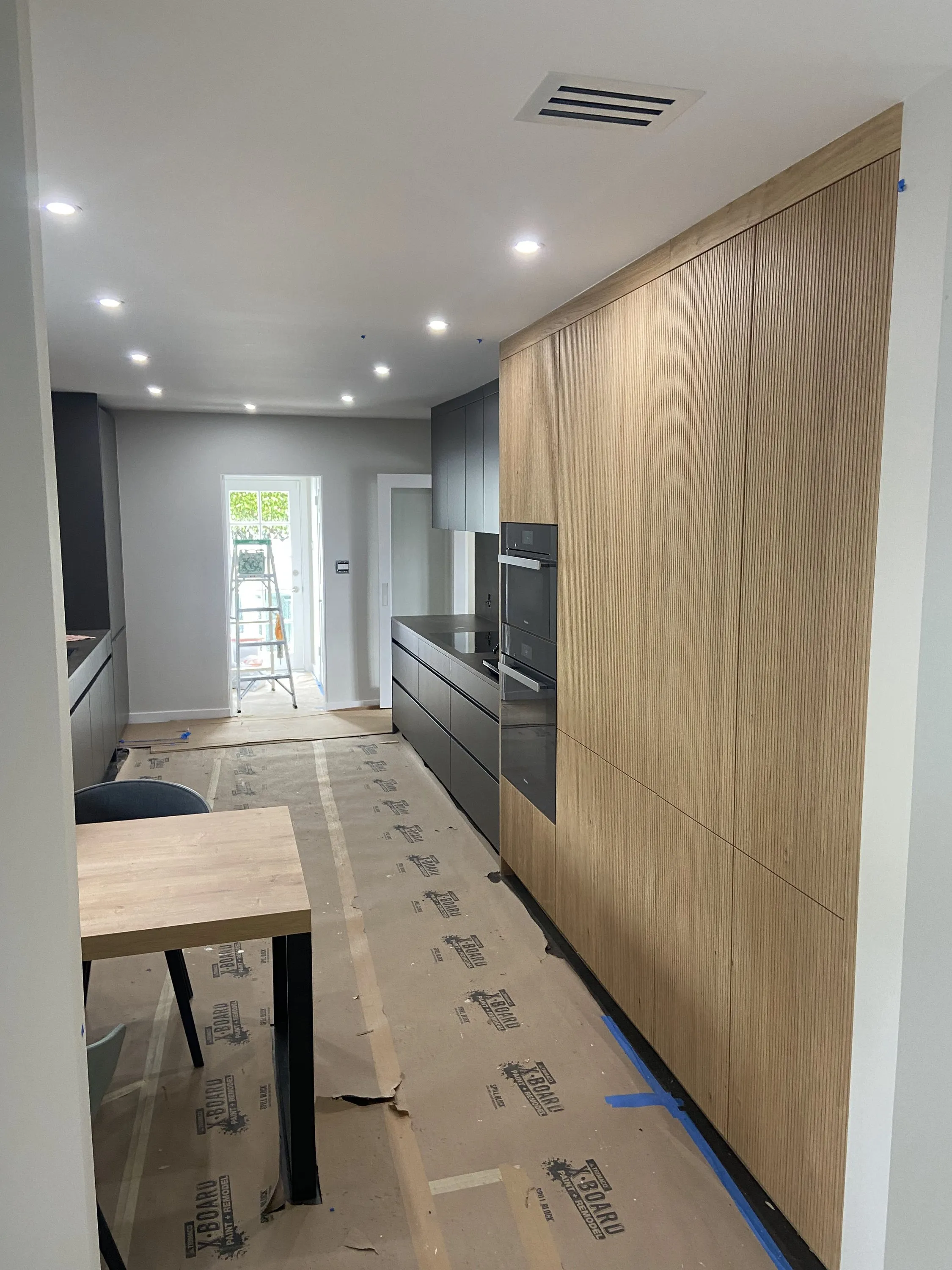 Slatted oak wall panels during installation
