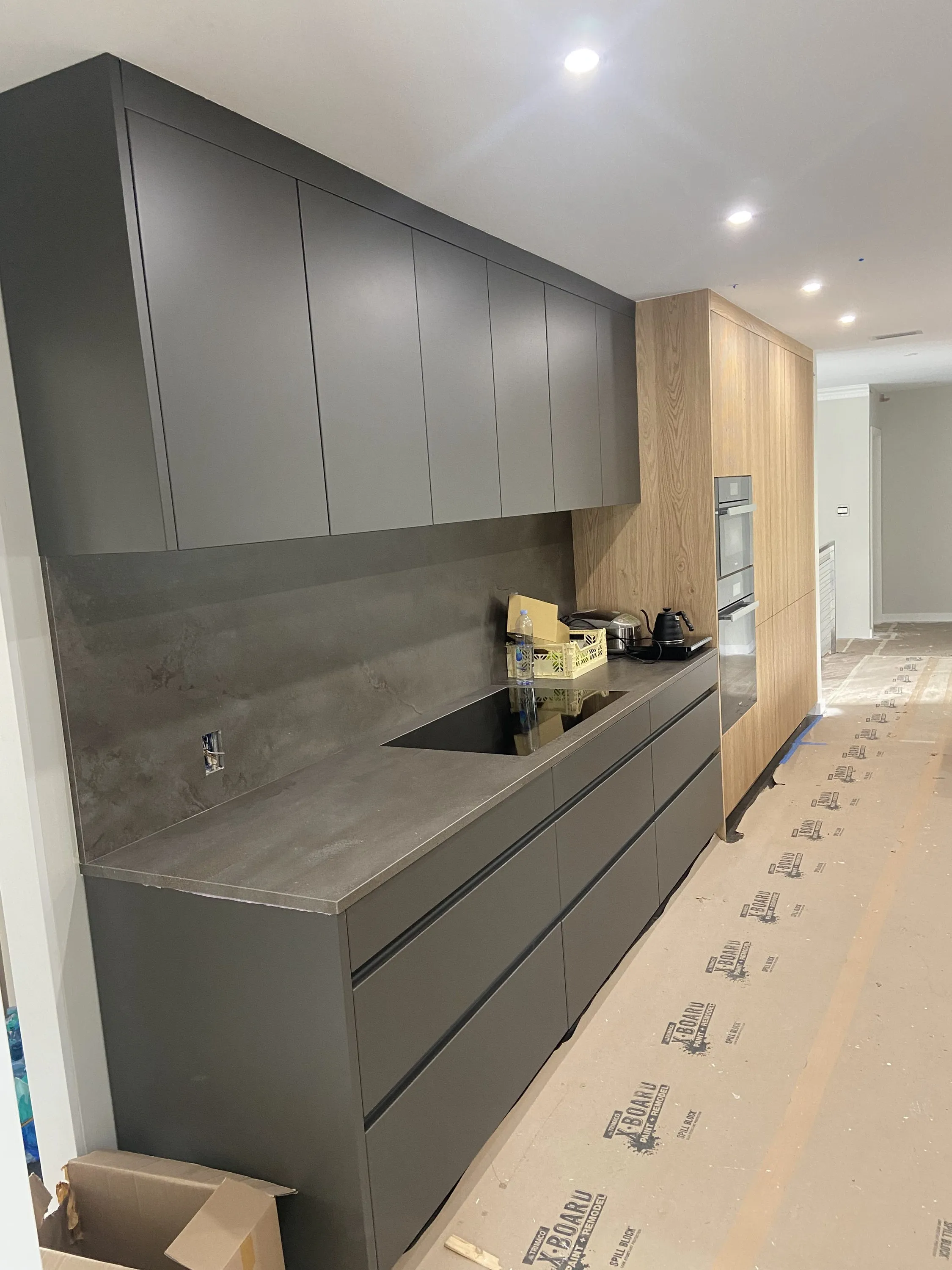 Cabinetry and stone backsplash during installation